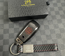 Load image into Gallery viewer, Brabus Style Premium Genuine Carbon Fiber Key Cover Case FOB For Mercedes AMG Model A45s CLA45s C63s E63S GLB35 GLC63S GLE63s C43 E53 G63 Exclusive Made
