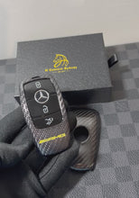 Load and play video in Gallery viewer, Premium Carbon Fiber Key Fob Cover Set For Mercedes C63s E63s GLC63s GLE63s GT63S AMG Model Exclusive AMG Edition One Pack
