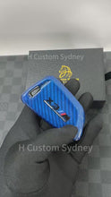 Load and play video in Gallery viewer, BMW Red &amp; Blue Two-Tone Carbon Fiber Key Cover + Matching Keychain Set Premium Real Carbon For M3 M4 M5 M8 X3M X4M X5M X6M Competition Model
