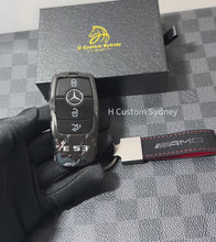 Load and play video in Gallery viewer, Premium Forged Carbon Fiber Key Fob Cover Keychain For Mercedes E53 AMG Model Exclusive Made
