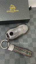 Load and play video in Gallery viewer, Luxury Carbon Fiber Key Case Keychain Premium Protective Cover Compatible with Porsche Macan EV 4S Turbo Key Fob Exclusive Edition
