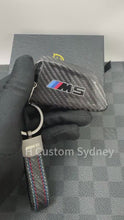 Load and play video in Gallery viewer, Luxury Genuine Carbon Fiber Keyring Key Fob Cover Kit For BMW M5 F90 F90 LCI Custom Made Exclusive Edition
